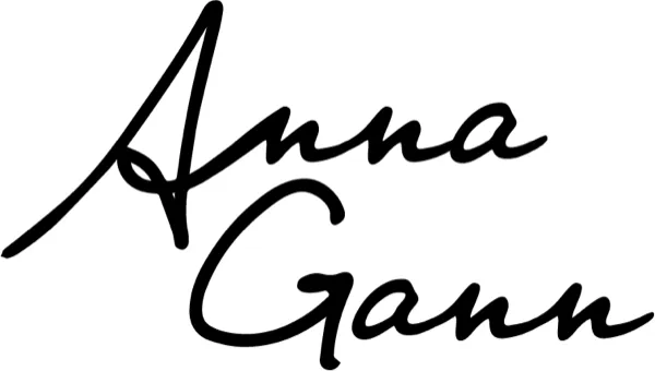 Anna Gann signature mark in black script.