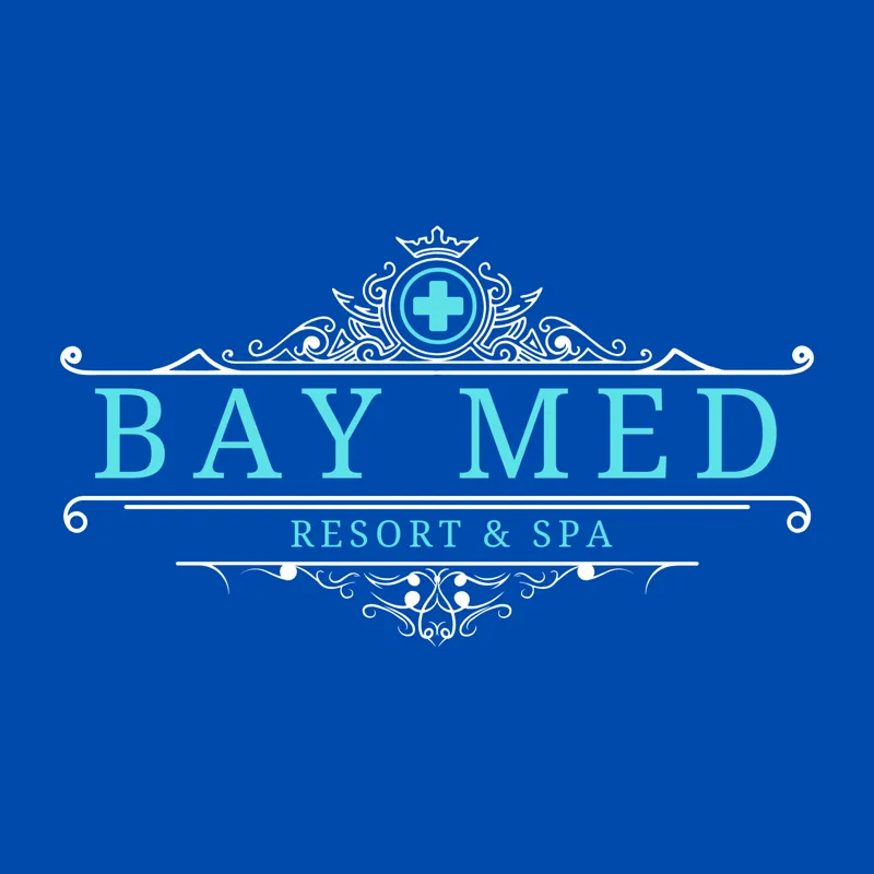 Bay Med Resort & Spa: an ornate crest with a medical cross in a crown, over a serif wordmark, in light blue on navy.