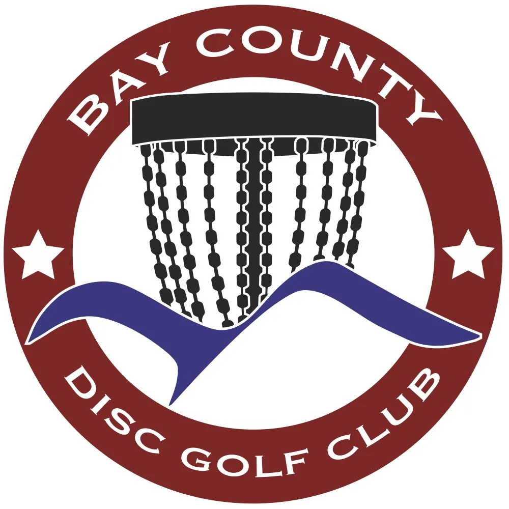 The original Bay County Disc Golf Club crest: a chained basket over a blue wave inside a maroon ring with two stars.