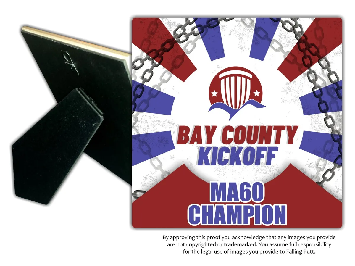 Vendor proof of a ceramic tile trophy on a black easel: the Bay County Kick Off crest over sunburst rays with chain accents, MA60 Champion.