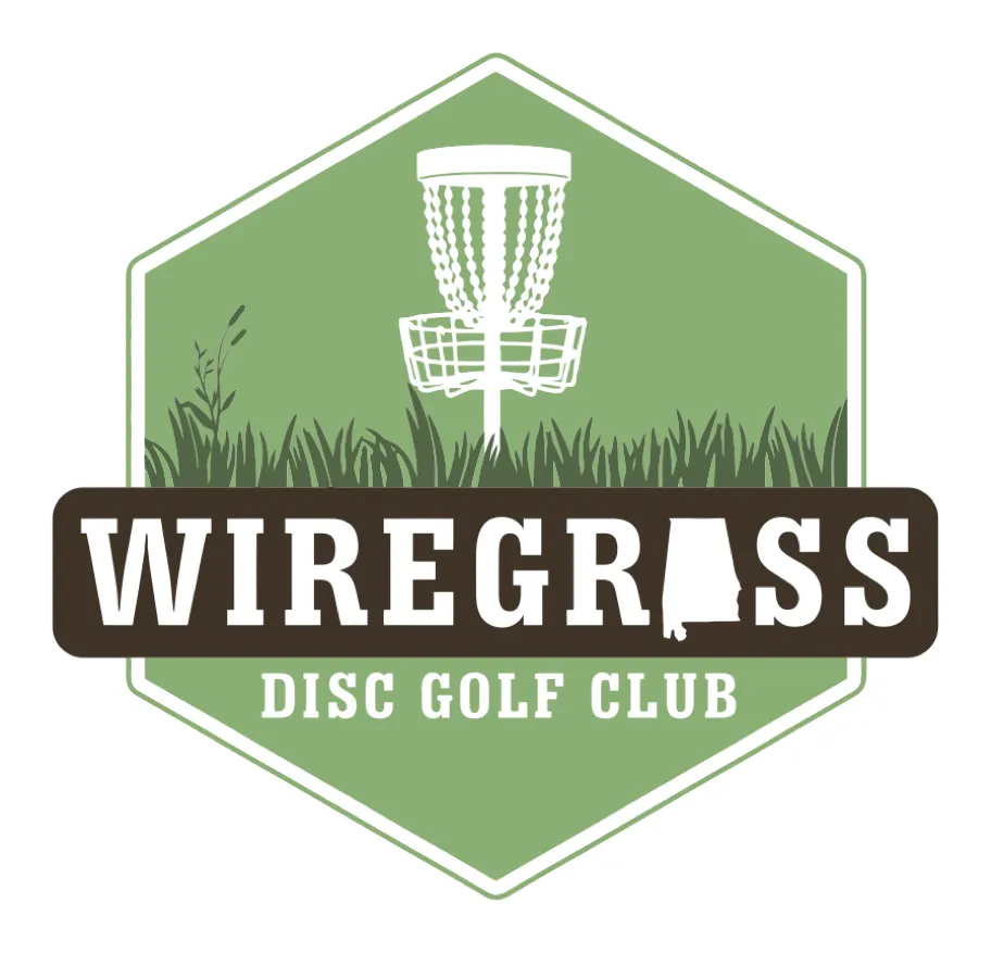 Wiregrass Disc Golf Club badge: a green hexagon with a basket standing in tall grass and the state of Alabama in the wordmark.